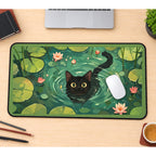 Black Cat Swimming in Lily Pond desk mat — product mockup 1