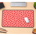 Red Stars on Pink desk mat — product mockup 1