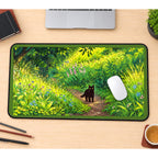 Black Cat on a Sunlit Forest Path desk mat — product mockup 1