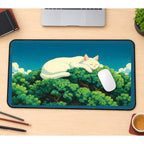 Giant Sleeping White Cat in Trees desk mat — product mockup 1