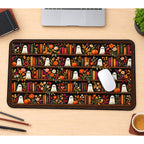 Bookish Ghosts on Flower Shelves desk mat — product mockup 1