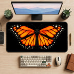 Orange Monarch on Black desk mat — product mockup 2