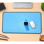 Swimming Black Kitten desk mat — product mockup 1