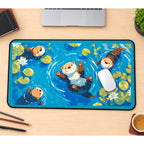 Otters Floating with Lily Pads desk mat — product mockup 1