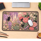 Black Cats among Pink Garden Blooms desk mat — product mockup 1