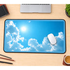 Sunshine between Fluffy White Clouds desk mat — product mockup 1