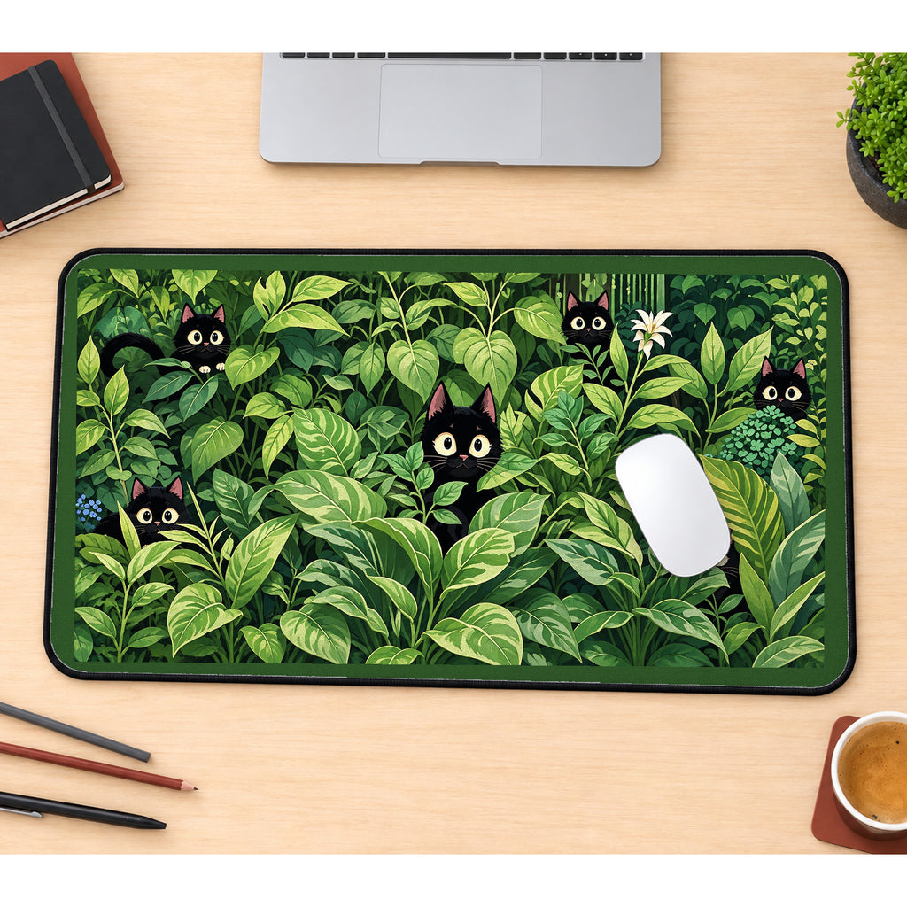 Black Kittens among Green Houseplants desk mat — product mockup 1