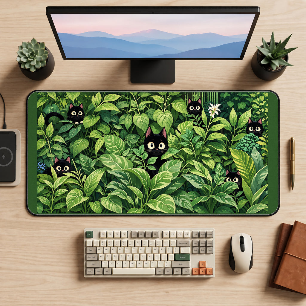Black Kittens among Green Houseplants desk mat — product mockup 2